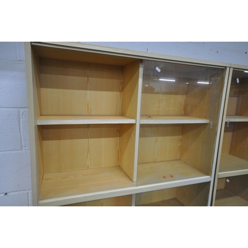 1218 - A PAIR OF MODERN BOOKCASES, with glass sliding doors, above double cupboard doors, width 91cm x dept... 