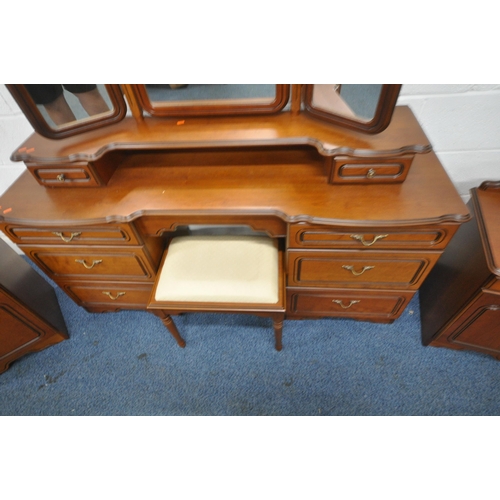 1221 - A MODERN FOUR PIECE BEDROOM SUITE, comprising a dressing table, fitted with a triple mirror and eigh... 