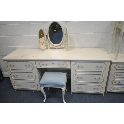 1234 - A CREAM FIVE PIECE BEDROOM SUITE, comprising a large dressing table, with seven drawers, length 184c... 