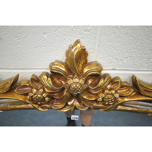 1236 - A LARGE FLAMBOYANT REPRODUCTION GILT RESIN WALL MIRROR, 183cm x 120cm (condition report: small chips... 