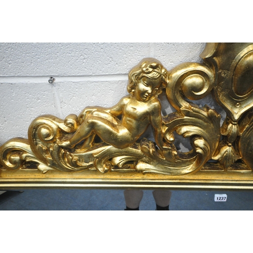 1237 - A LARGE FLAMBOYANT REPRODUCTION GILT WOOD BEVELED EDGE OVERMANTEL MIRROR, the crest depicting two se... 