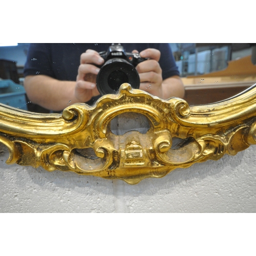 1242 - A REPRODUCTION GILT WOOD MARBLE TOP SERPENTINE CONSOLE TABLE, with scrolled details, width 128cm x d... 