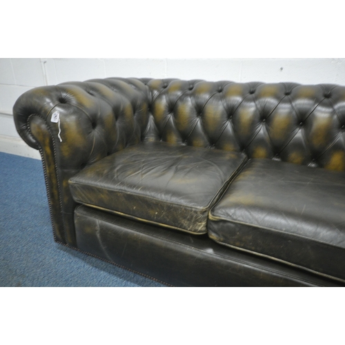 1243 - AN OLIVE GREEN THREE SEATER CHESTERFIELD SOFA, length 228cm x depth 90cm x height 74cm (condition re... 