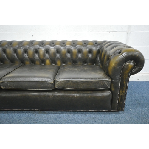 1243 - AN OLIVE GREEN THREE SEATER CHESTERFIELD SOFA, length 228cm x depth 90cm x height 74cm (condition re... 