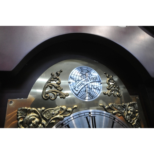 1244 - A MODERN MAHOGANY EFFECT LONGCASE CLOCK, with twin swan neck pediment, a single finial, the arched d... 