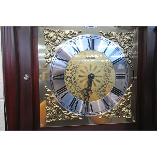 1244 - A MODERN MAHOGANY EFFECT LONGCASE CLOCK, with twin swan neck pediment, a single finial, the arched d... 