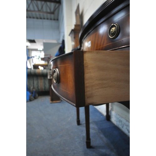 1247 - A REPRODUCTION MAHOGANY SERPENTINE SIDEBOARD, with a raised back, two drawers, flanked by two cupboa... 