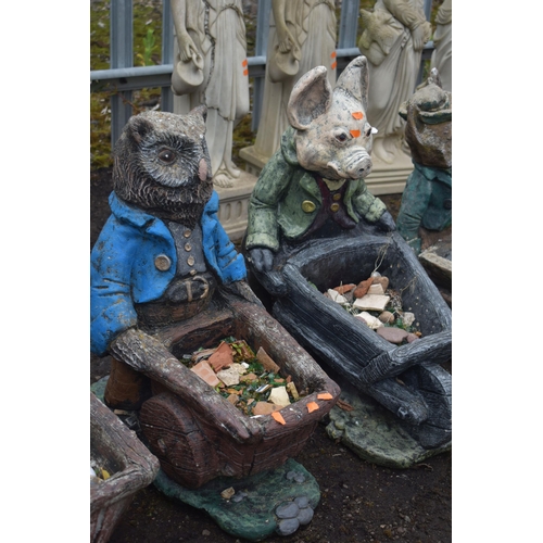 1006 - A SET OF THREE NOVELTY GARDEN FIGURES / PLANTERS, of a duck, owl and a pig carrying a wheelbarrow (c... 