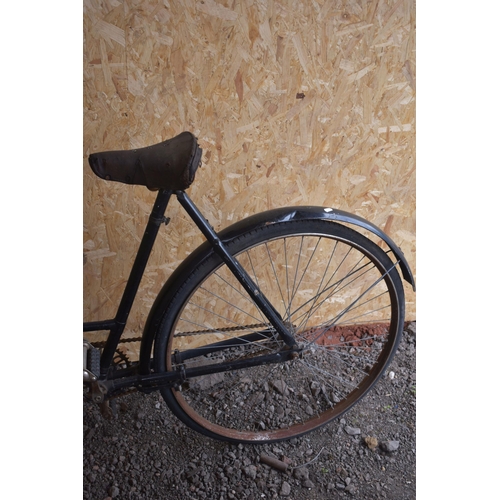 1010 - A VINTAGE BLACK LADIES DUNELT BIKE, with a curved 22 ''  frame, leather saddle and wicker basket (co... 