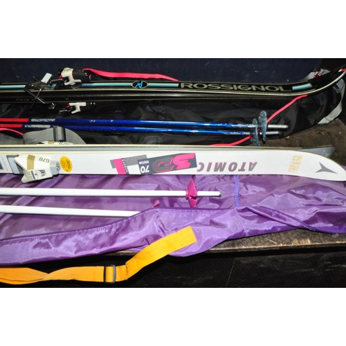 1051 - TWO SETS OF SKIs AND POLES comprising of a pair of Atomic 3D Carbon 170 and Tyrolian poles and a pai... 