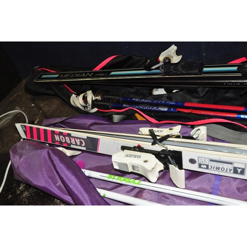 1051 - TWO SETS OF SKIs AND POLES comprising of a pair of Atomic 3D Carbon 170 and Tyrolian poles and a pai... 