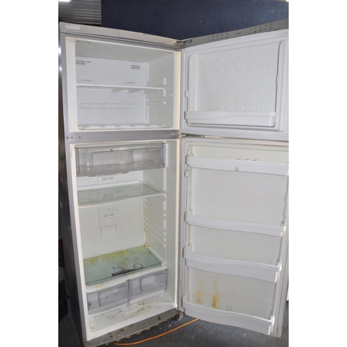 1059 - AN INDESIT LARGE FRIDGE FREEZER width 70cm depth 65cm height 190cm (PAT pass and working at 4 and -2... 