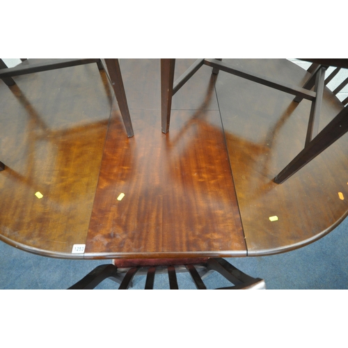 1253 - A STAG MINSTREL EXTENDING DINING TABLE, extended length 160cm x diameter 116cm x height 75cm, along ... 