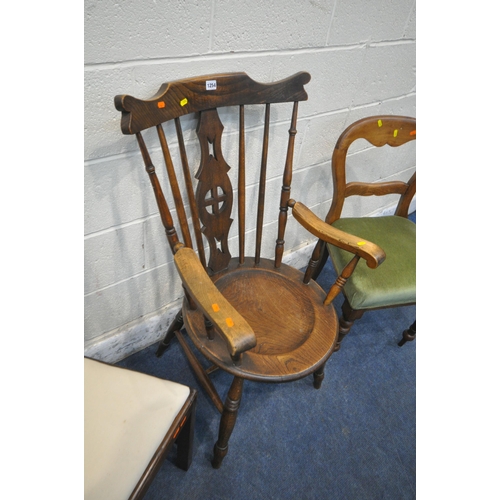 1254 - A 20TH CENTURY ELM ARMCHAIR, with central splat, dish seat, raised on turned legs, united by stretch... 