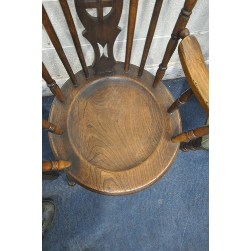 1254 - A 20TH CENTURY ELM ARMCHAIR, with central splat, dish seat, raised on turned legs, united by stretch... 