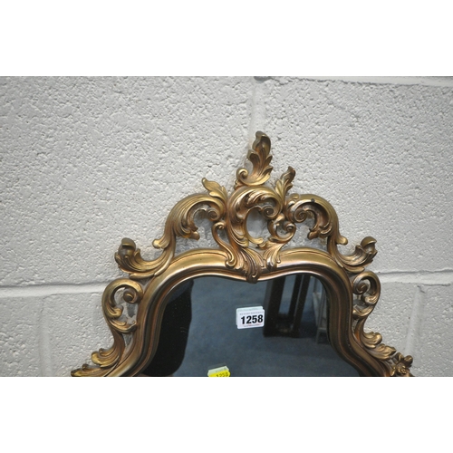 1258 - A SYROCO GILT FRAME FLAMBOYANT WALL MIRROR, 50cm x 74cm, along with another wall mirror (2)