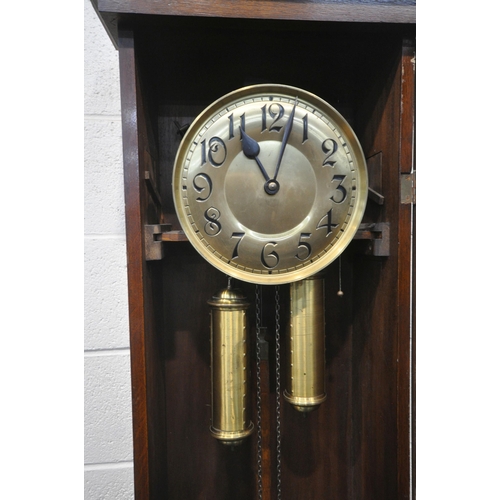 1262 - A 20TH CENTURY OAK LONGCASE CLOCK, the trunk door enclosing a brass 10.5 inch dial, depicting Arabic... 