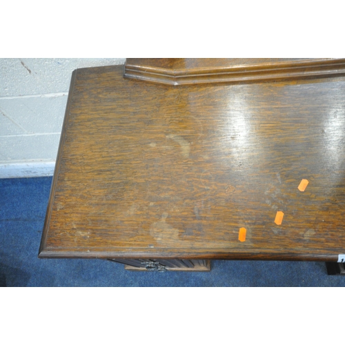 1280 - AN EARLY 20TH CENTURY OAK DRESSING TABLE, fitted with a single mirror, and six assorted drawers, wid... 