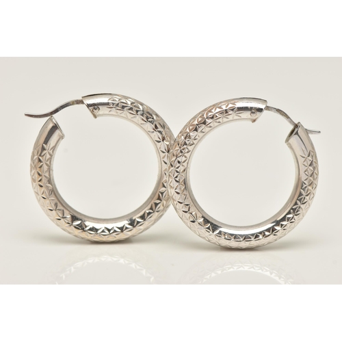 23 - A PAIR OF 9CT GOLD HOOP EARRINGS, hollow white gold hoops with diamond cut pattern detail, fitted wi... 