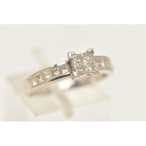 25 - AN 18CT GOLD DIAMOND RING, designed as four princess cut diamonds in an invisible setting, flanked w... 