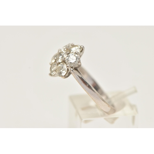 27 - AN 18CT GOLD DIAMOND CLUSTER RING, seven round brilliant cut diamonds, prong set in white gold, appr... 