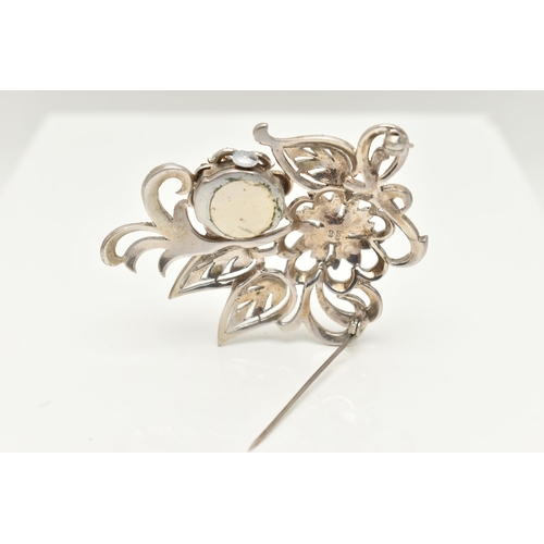 38 - A 'BUCHERER' BROOCH WATCH, a white metal floral brooch set with marcasite, hinged flower lifting to ... 