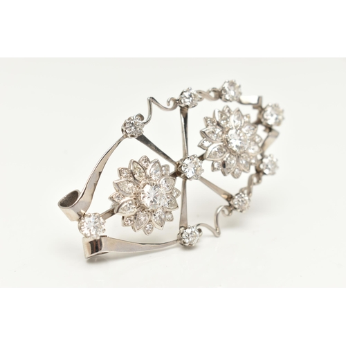 44 - AN 18CT WHITE GOLD AND DIAMOND PENDANT BROOCH, designed as an open work navette form brooch, central... 