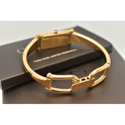 52 - A LADIES 'GUCCI' WRISTWATCH, quartz movement, rectangular black dial, signed 'Gucci', gold plated ca... 