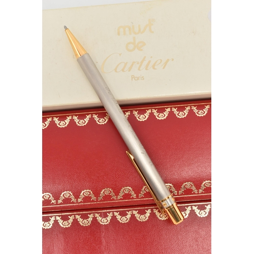 62 - MUST DE CARTIER BALLPOINT PEN WITH MAKER'S CASE AND PAPERWORK, designed with brushed finish and gilt... 