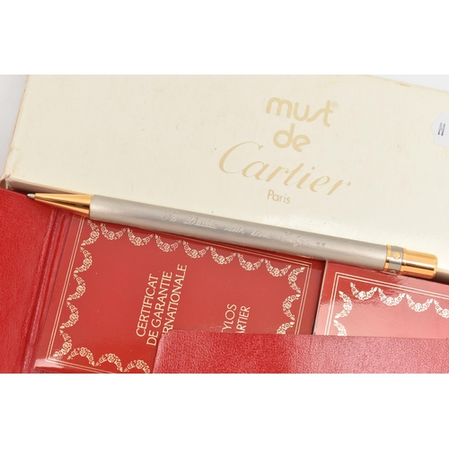 62 - MUST DE CARTIER BALLPOINT PEN WITH MAKER'S CASE AND PAPERWORK, designed with brushed finish and gilt... 