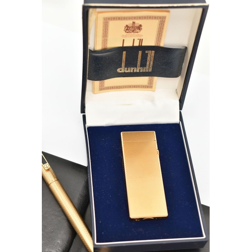 64 - THREE DUNHILL ITEMS, to include an engine turned Dunhill lighter, with maker's case and guarantee, a... 