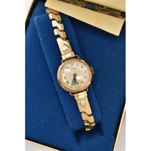 65 - A LADIES 9CT WATCH, A ROSE METAL RING MOUNT, AND A PAIR OF EARRINGS, to include a ladies manual wind... 