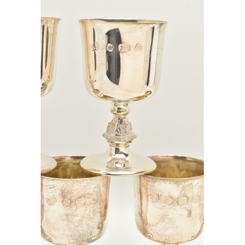 66 - A SET OF SIX ELIZABETH II SILVER GOBLETS, the bucket shaped bowl with gilt interior, on stem cast wi... 