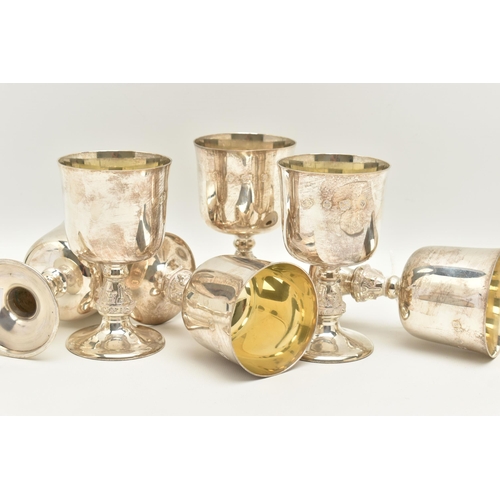 66 - A SET OF SIX ELIZABETH II SILVER GOBLETS, the bucket shaped bowl with gilt interior, on stem cast wi... 