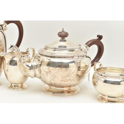 67 - A GEORGE V SILVER FOUR PIECE TEA SERVICE, cast with a band of quatrefoil decoration and foliate scro... 