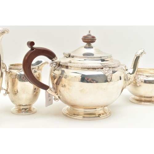 67 - A GEORGE V SILVER FOUR PIECE TEA SERVICE, cast with a band of quatrefoil decoration and foliate scro... 