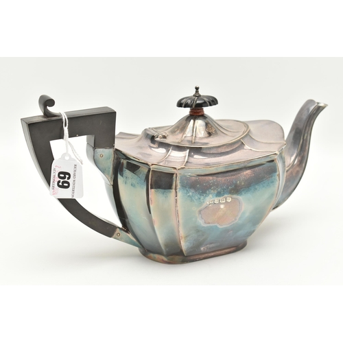 69 - A SILVER TEAPOT, faceted polished design fitted with an ebonised handle and finial, hallmarked Birmi... 