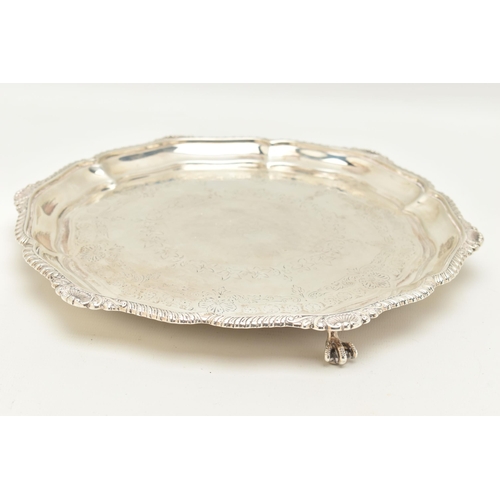 73 - AN EDWARDIAN ELKINGTON & CO SILVER SALVER, the gadrooned and shell cast rim with pie crust edge, the... 