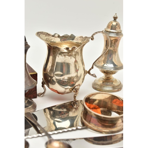 79 - ASSORTED SILVER ITEMS, to include a milk jug wavy rim, raised on four cabriole legs and scroll handl... 