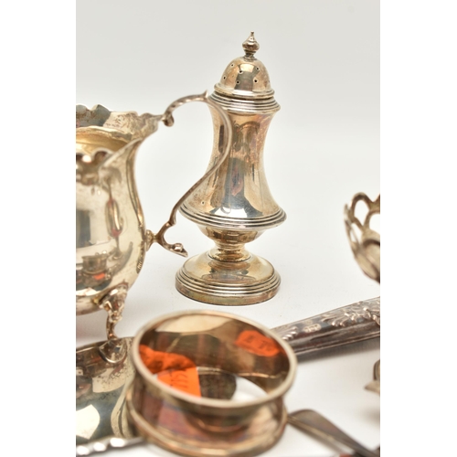 79 - ASSORTED SILVER ITEMS, to include a milk jug wavy rim, raised on four cabriole legs and scroll handl... 