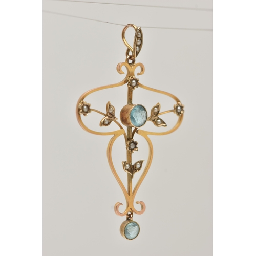 9 - A YELLOW METAL LAVALIER PENDANT, open work floral design, set with a central circular cut blue topaz... 