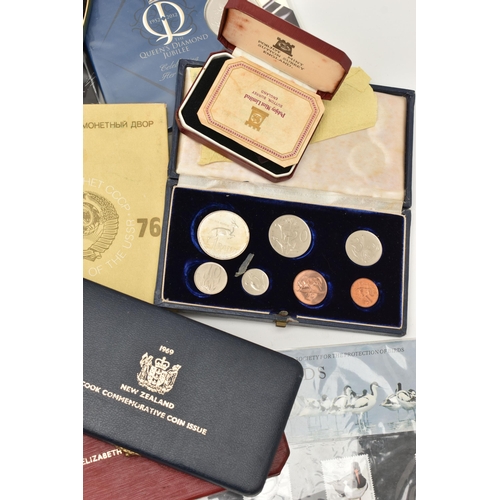 103 - A CARDBOARD BOX CONTAINING CASED COINS AND YEAR COIN SETS, to include UK 1977 1978, Austria Proofs 1... 