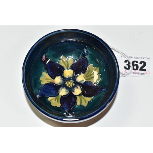 362 - A MOORCROFT POTTERY 'COLUMBINE' SMALL FOOTED BOWL, tube lined with a yellow and purple columbine on ... 