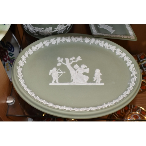 365 - FIVE PIECES OF SAGE GREEN WEDGWOOD JASPERWARE, comprising a covered pot, an oval tray, a vase height... 