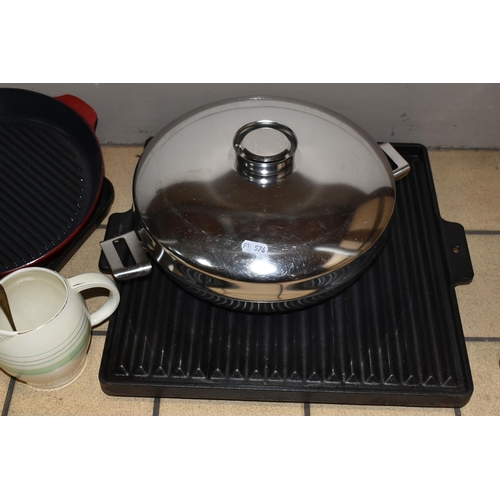 367 - A GROUP OF KITCHENWARE, comprising a red cast iron AGA 907308 griddle pan, a square AGA griddle pan ... 