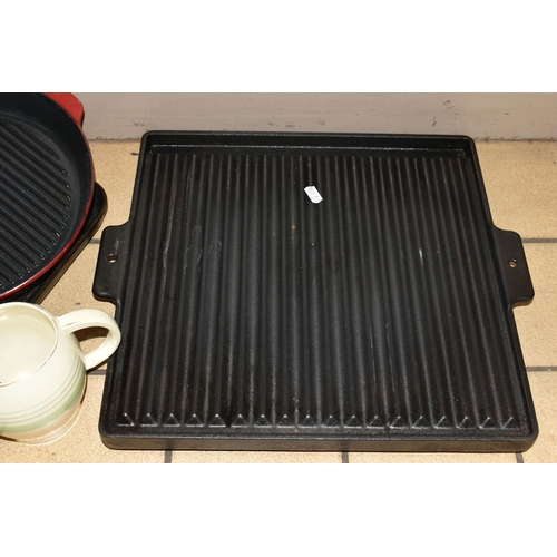 367 - A GROUP OF KITCHENWARE, comprising a red cast iron AGA 907308 griddle pan, a square AGA griddle pan ... 