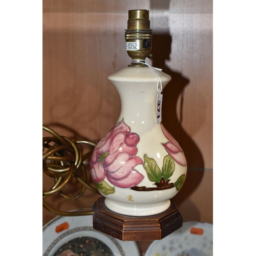 371 - A MOORCROFT POTTERY 'MAGNOLIA' PATTERN TABLE LAMP BASE, tube lined with pink magnolia flowers on a c... 