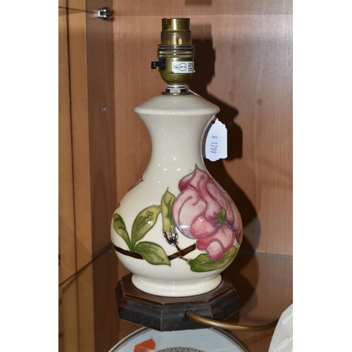 371 - A MOORCROFT POTTERY 'MAGNOLIA' PATTERN TABLE LAMP BASE, tube lined with pink magnolia flowers on a c... 