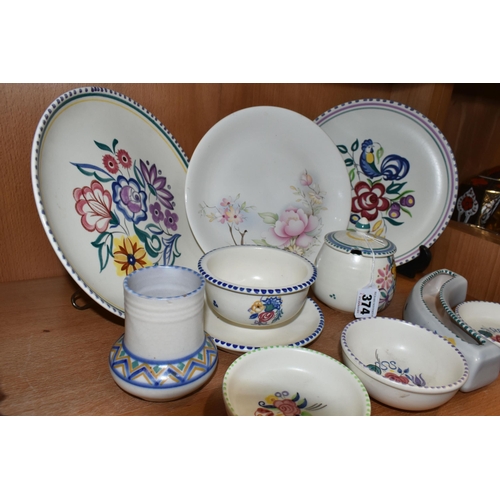 374 - A GROUP OF POOLE POTTERY, mainly traditional ware, comprising a Blue Cockerel plate, a grapefruit/ic... 