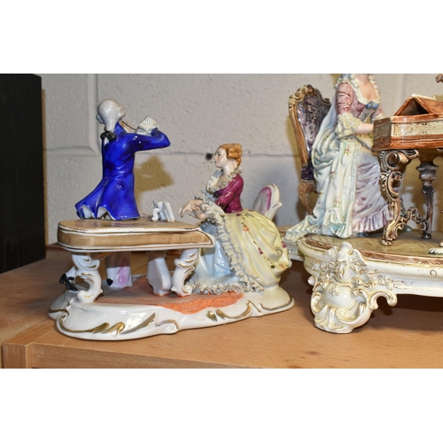 377 - FOUR CONTINENTAL PORCELAIN FIGURAL GROUPS, comprising a large figural group of a lady playing the pi... 